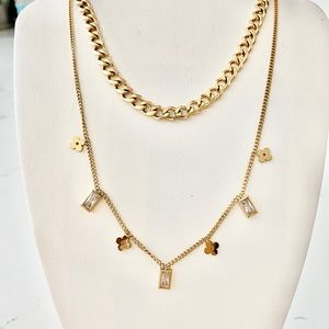 2 for 1 special. Cuban link necklace and floral baguette drop necklace.
